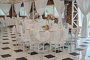 Chairs and table decorated with flowers. Special wedding concept