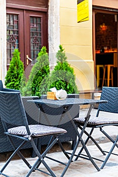 Chairs and table on empty terrace at cafe