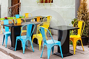 Chairs and table on empty terrace at cafe