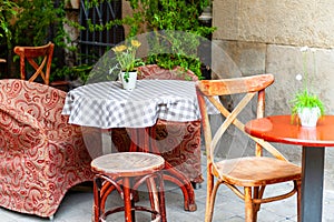 Chairs and table on empty terrace at cafe