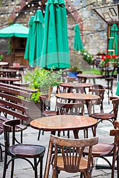 Chairs and table on empty terrace at cafe