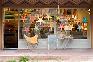 Chairs and table in front a store front