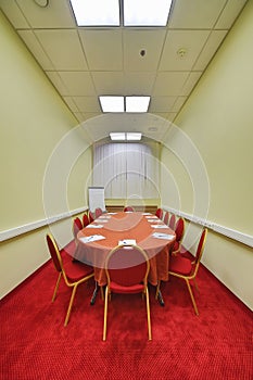 Chairs and table in modern empty conference room