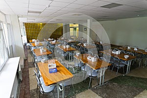 Chairs and tables. The dining hall in school is quarantined, isolation