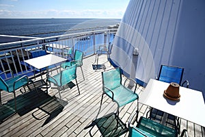 Chairs and tables on a ferry deck