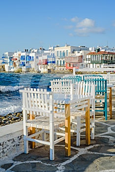 Chairs with tables in Greek tavern in Little Venice part of Mykonos town, Mykonos, Greece