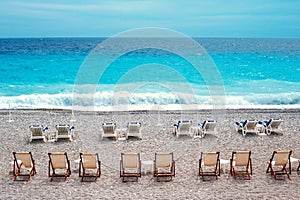 Chairs and tables on Nice beach along Promenade des Anglais