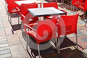 Chairs and tables in a non-working cafe, closed during the Covid-19 pandemic