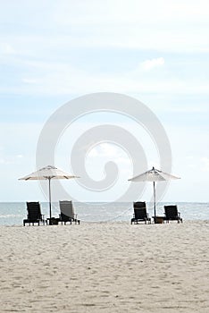 Chairs and umbrella by the beach