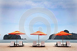 CHAIRS AND UMBRELLA ON BEACH IN LANGKAWI