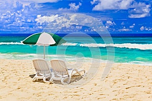 Chairs and umbrella at tropical beach