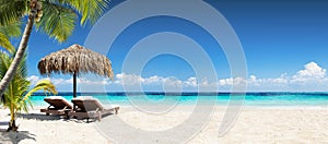 Chairs And Umbrella In Tropical Beach