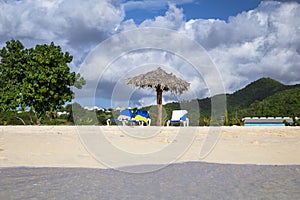 Chairs and umbrella at a tropical beach