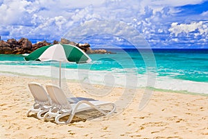 Chairs and umbrella at tropical beach