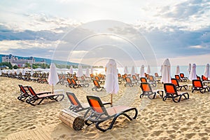 Chairs and umbrellas on a beautiful beach at sunrise in Sunny Beach on the Black Sea coast of Bulgaria