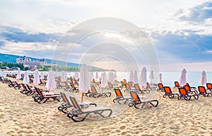 Chairs and umbrellas on a beautiful beach at sunrise in Sunny Beach on the Black Sea coast of Bulgaria