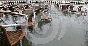 chairs on the water during the record flood in Venice in winter photo