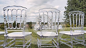 Chairs with wedding arch before the ceremony.