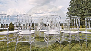 Chairs with wedding arch before the ceremony.