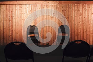 Chairs on a wooden theatre stage for improv practice photo