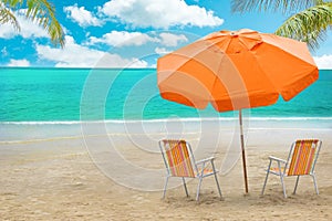 Chaise lounge, coconut and umbrella on tropical beach