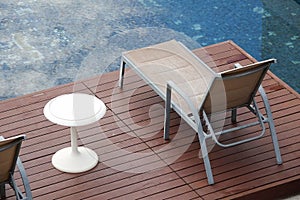 Chaise lounges around swimming pool