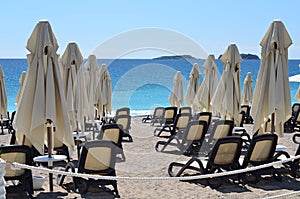 Chaise lounges on ocean beach