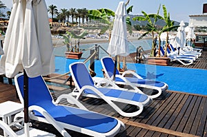 Chaise lounges from the sun on a beach photo