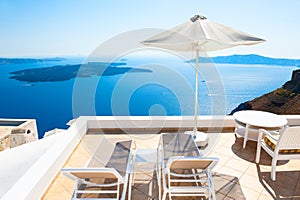 Chaise lounges on the terrace. Santorini island, Greece