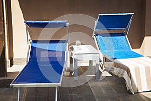 Chaise lounges with towels