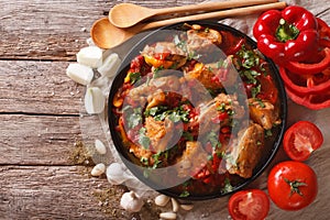 Chakhokhbili chicken stew with vegetables on the table. horizont photo
