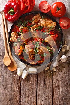 Chakhokhbili chicken stew with vegetables on the table. vertical photo
