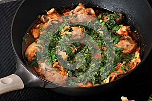 Chakhokhbili - traditional Georgian dish. Chicken stewed with he