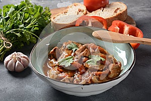Chakhokhbili - traditional Georgian dish. Chicken stewed with fresh coriander tomatoes and herbs