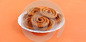 Chakli Indian Savory Snack in a Plate photo