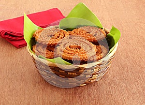 Chakli Indian Savory Snack on a Banana Leaf in a Basket