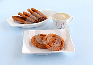 Chakli Indian Savory Snack on a Plate and Coffee