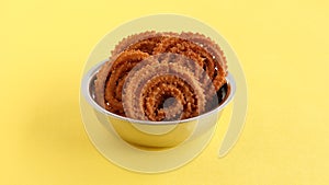 Chakli Indian Savory Snack in a Steel Bowl