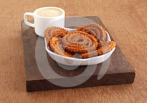 Chakli Indian Savory Snack in a Tray and Coffee