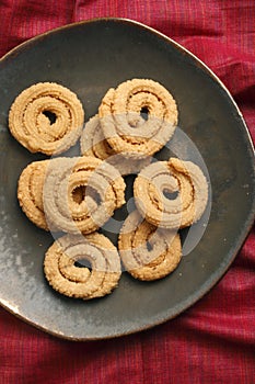 Chakli is a popular Indian festive snack photo