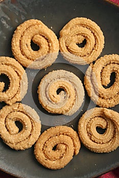 Chakli is a popular Indian festive snack photo