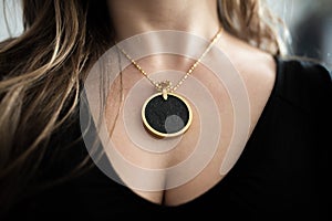 Chakra medallion hanging on the woman`s chest