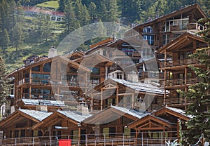 Chalet and hotels in swiss village in Alps, Wallis, Valais Switzerland. Traditional swiss wooden houses.