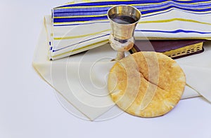 Chalice with red wine bread and Holy Bible