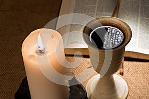 Chalice of wine and bible