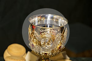 Chalice with wine for Communion in orthodox Church. Gold Plated, decorated.