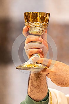 chalice of wine during the eucharistic rite of the holy mass