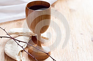 Chalice of wine, passover bread, thorns as Jesus Last Supper and Passion of Christ concept