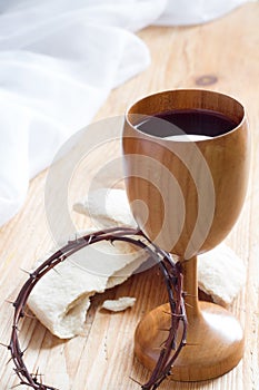 Chalice of wine, passover bread, thorns as Jesus Last Supper and Passion of Christ concept