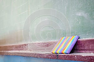 Chalk and board in classroom